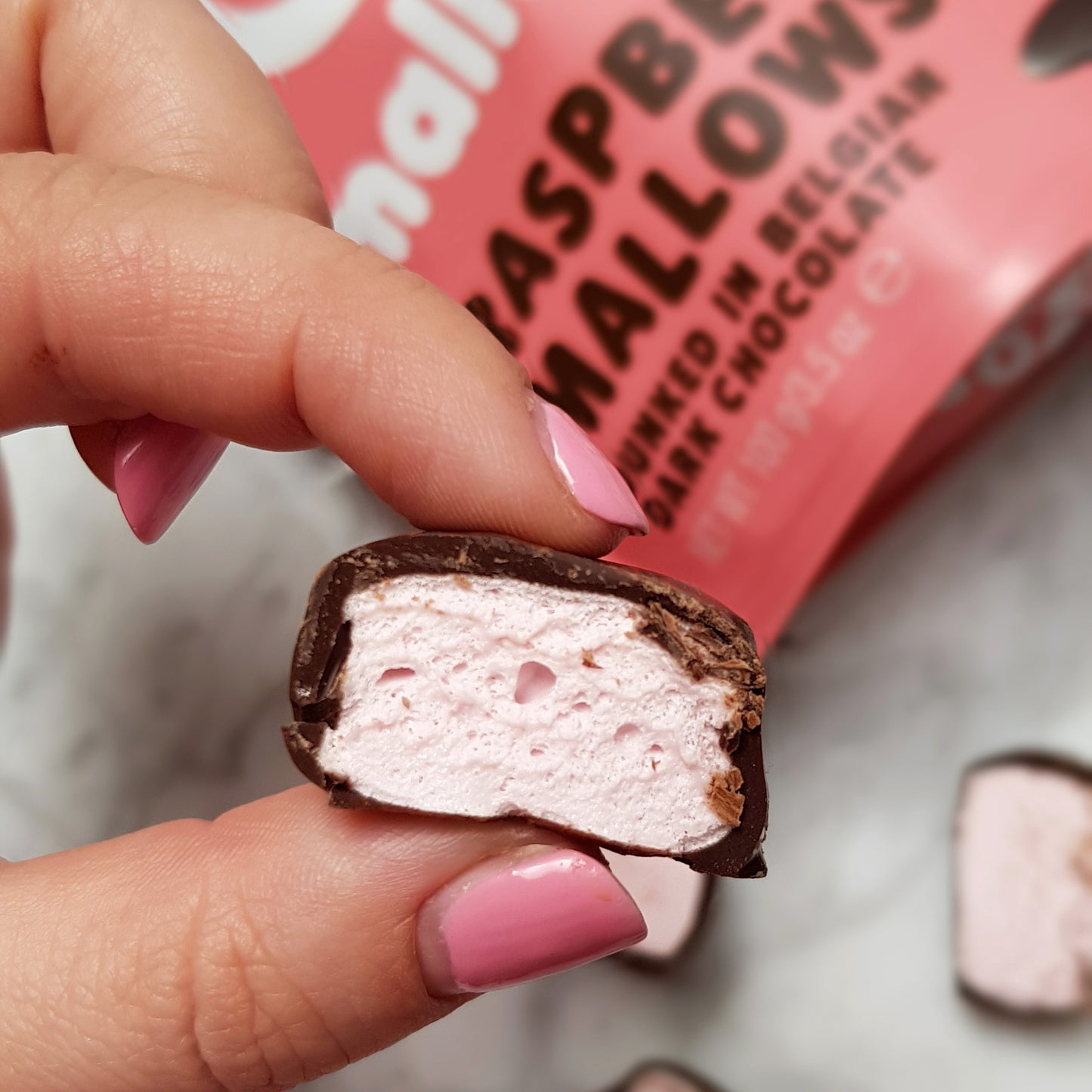Raspberry Mallows dunked in Belgian Dark Chocolate